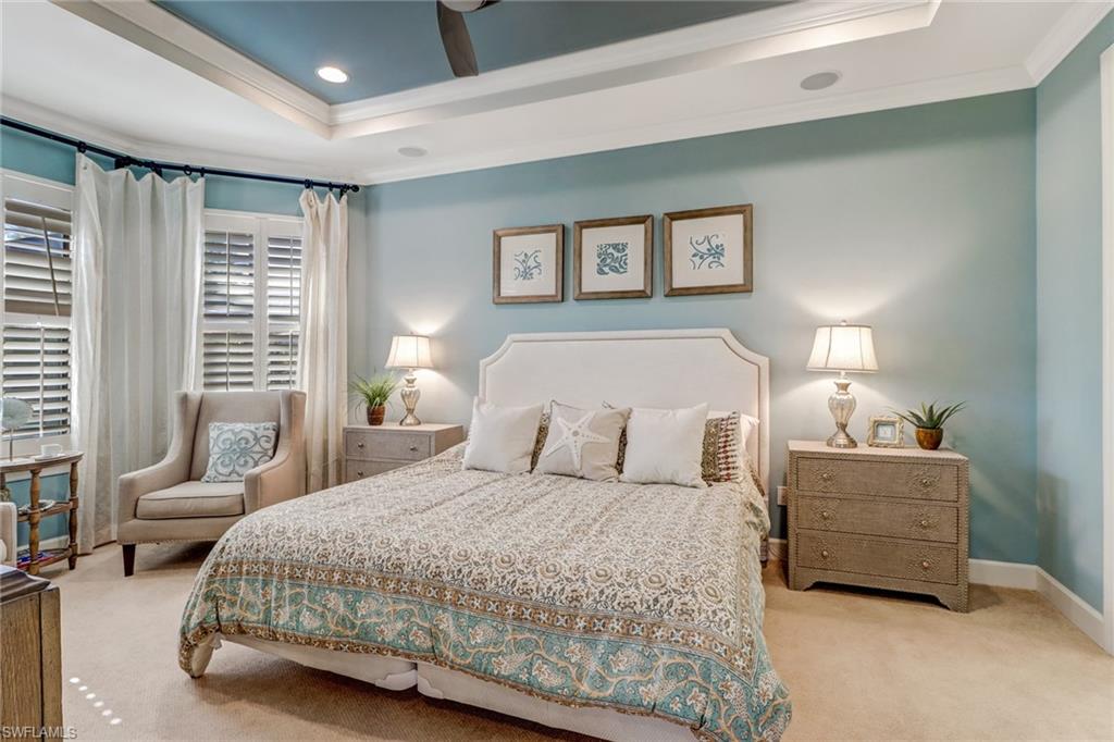 3280 Miyagi Lane Naples, FL 34114 - Photo 13 of 25 a bedroom with a bed and lamp
