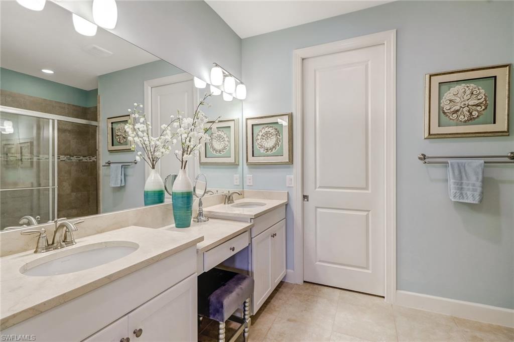 3280 Miyagi Lane Naples, FL 34114 - Photo 15 of 25 a view of bathroom with dual sinks