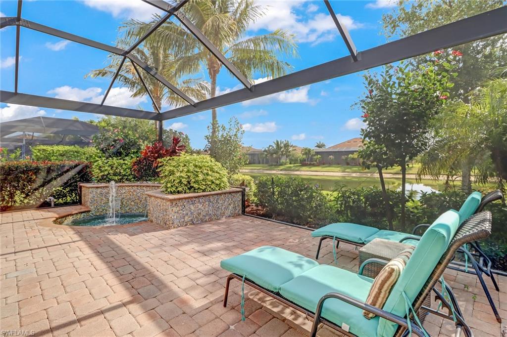 3280 Miyagi Lane Naples, FL 34114 - Photo 25 of 25 a view of a chairs and table in patio with a lake view