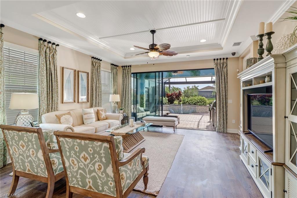 3280 Miyagi Lane Naples, FL 34114 - Photo 8 of 25 a living room with furniture and a large window