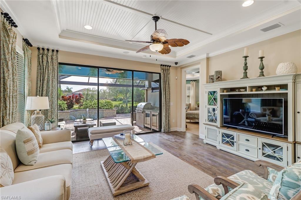 3280 Miyagi Lane Naples, FL 34114 - Photo 9 of 25 a living room with furniture large window and a flat screen tv