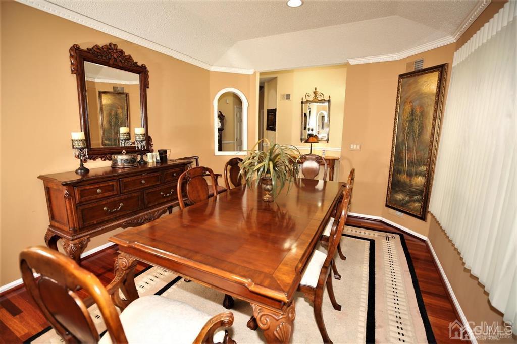 49 Harwood Road Monroe Township, NJ 08831 - Photo 12 of 73 a dining room with furniture and wooden floor