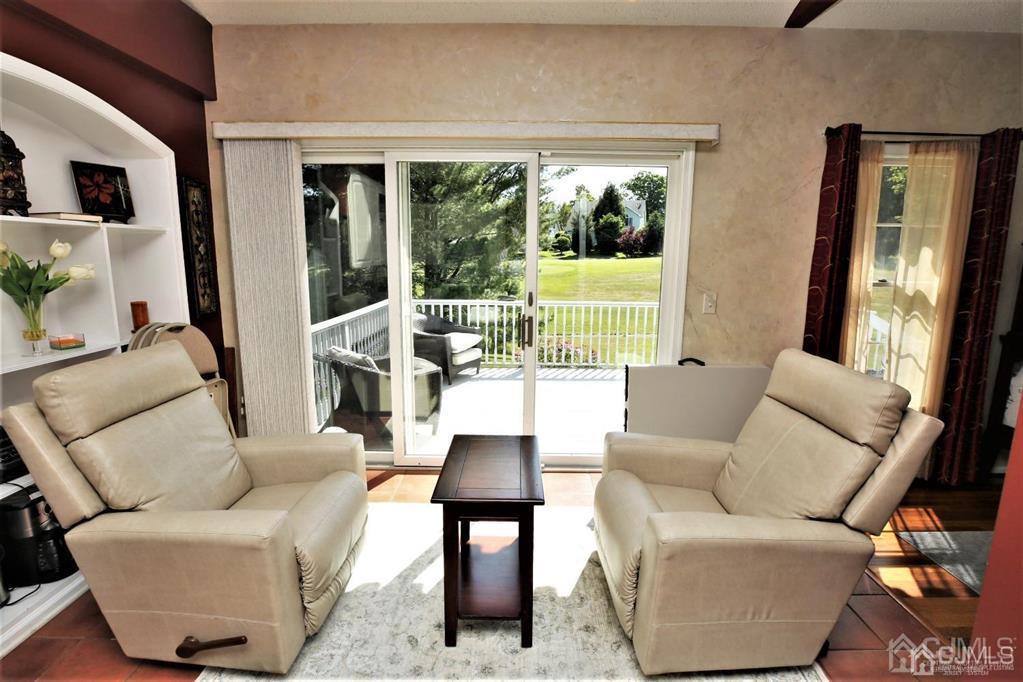 49 Harwood Road Monroe Township, NJ 08831 - Photo 20 of 73 a living room with furniture and a large window