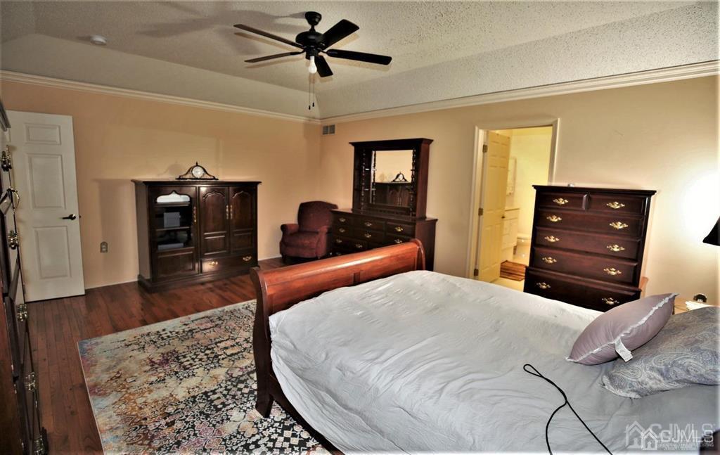 49 Harwood Road Monroe Township, NJ 08831 - Photo 27 of 73 a bedroom with a bed and a dresser