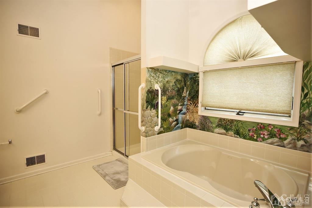 49 Harwood Road Monroe Township, NJ 08831 - Photo 28 of 73 a bathroom with a bathtub and a shower
