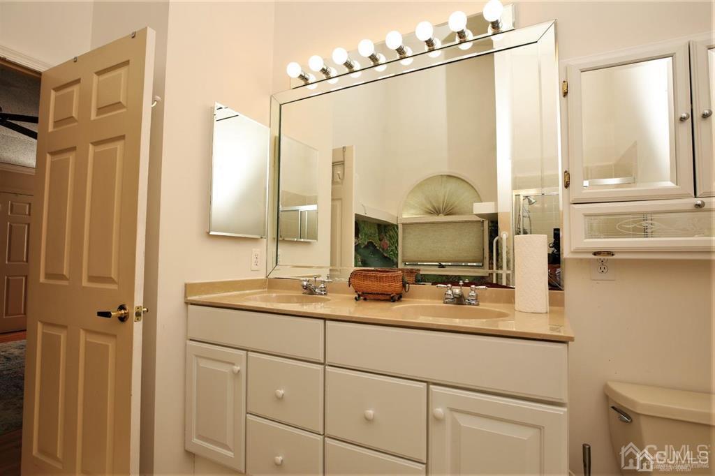 49 Harwood Road Monroe Township, NJ 08831 - Photo 30 of 73 a bathroom with a sink and a mirror