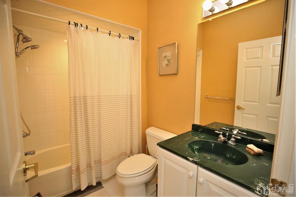 49 Harwood Road Monroe Township, NJ 08831 - Photo 33 of 73 a bathroom with a granite countertop sink toilet and shower
