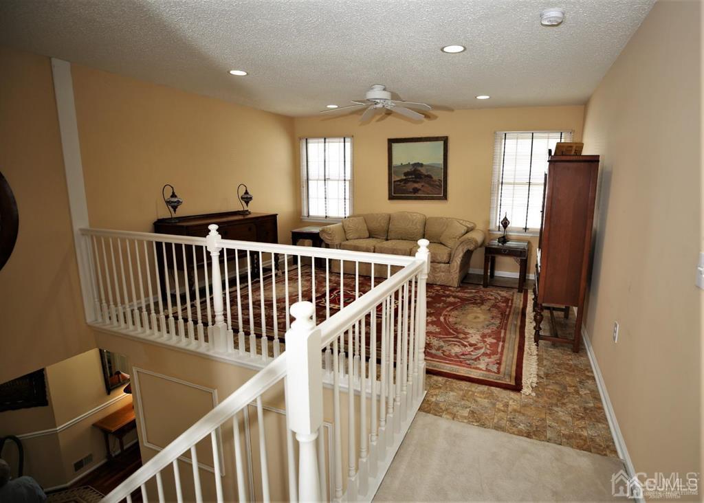 49 Harwood Road Monroe Township, NJ 08831 - Photo 36 of 73 a view of a hallway with furniture and windows