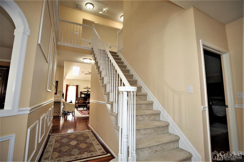 49 Harwood Road Monroe Township, NJ 08831 - Photo 4 of 73 a view of entryway and hall with wooden floor
