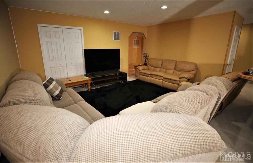 49 Harwood Road Monroe Township, NJ 08831 - Photo 47 of 73 a bedroom with two beds and a flat screen tv