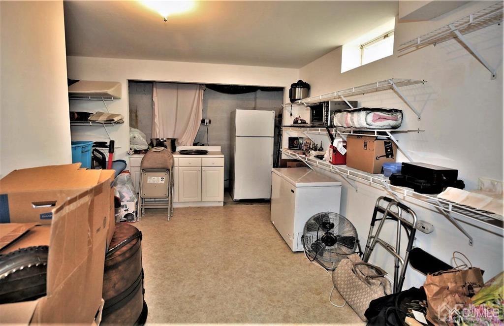 49 Harwood Road Monroe Township, NJ 08831 - Photo 56 of 73 a view of a kitchen with workspace and a window