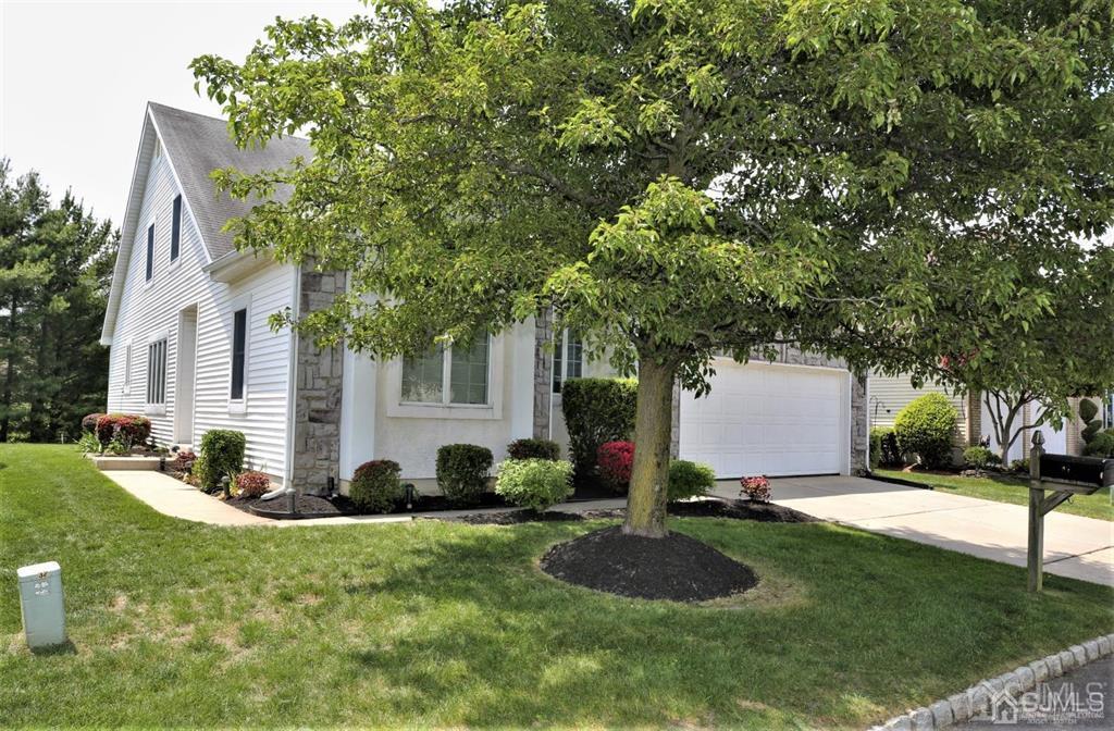 49 Harwood Road Monroe Township, NJ 08831 - Photo 58 of 73 a view of a white house with a yard and plants