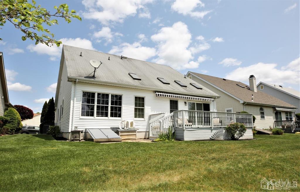 49 Harwood Road Monroe Township, NJ 08831 - Photo 62 of 73 a front view of a house with a garden and plants