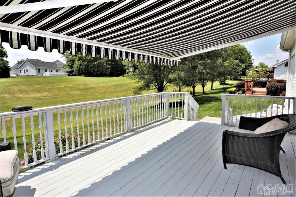 49 Harwood Road Monroe Township, NJ 08831 - Photo 69 of 73 a view of a house with backyard and sitting area