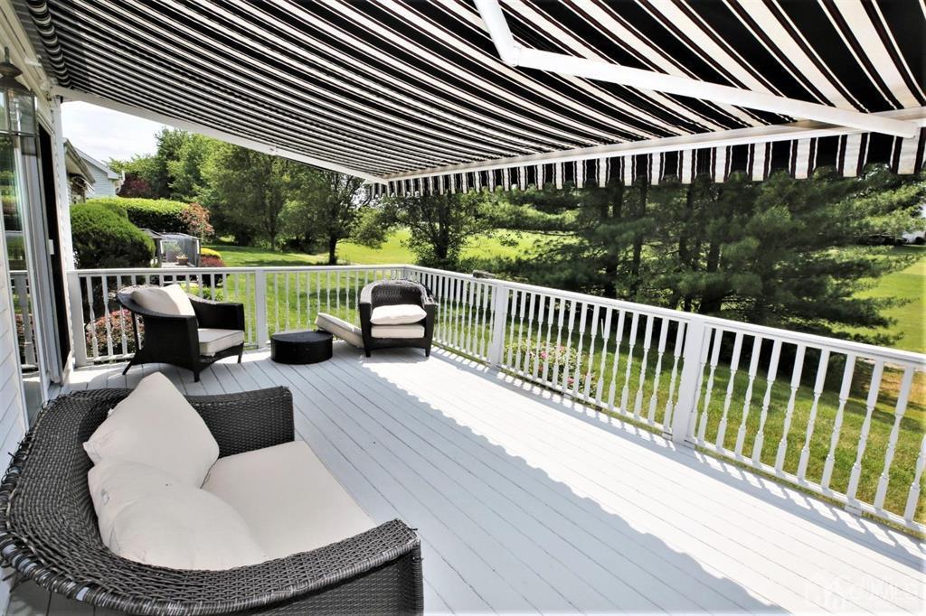 49 Harwood Road Monroe Township, NJ 08831 - Photo 70 of 73 a view of a patio with couches table and chairs and potted plants