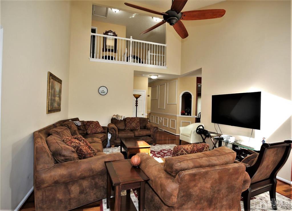 49 Harwood Road Monroe Township, NJ 08831 - Photo 8 of 73 a living room with furniture and a flat screen tv