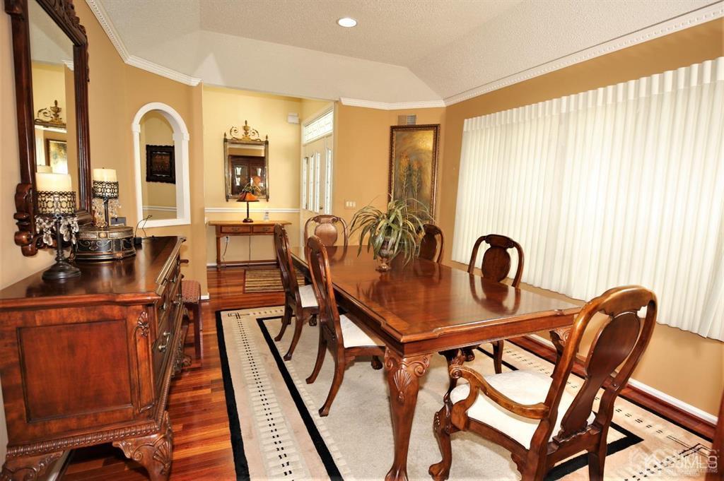 49 Harwood Road Monroe Township, NJ 08831 - Photo 10 of 73 a view of a dining room with furniture and chandelier