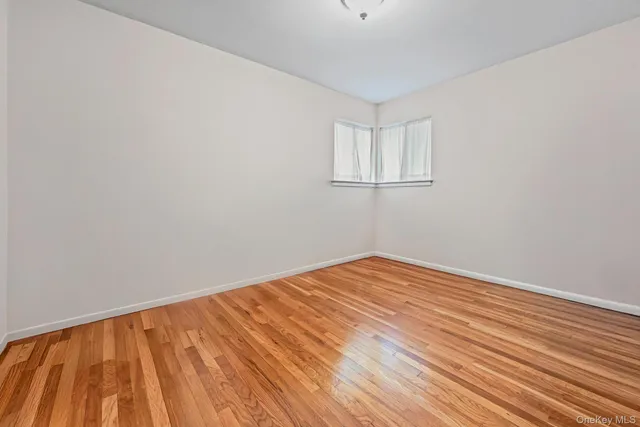 a bathroom with a sink toilet and a mirror