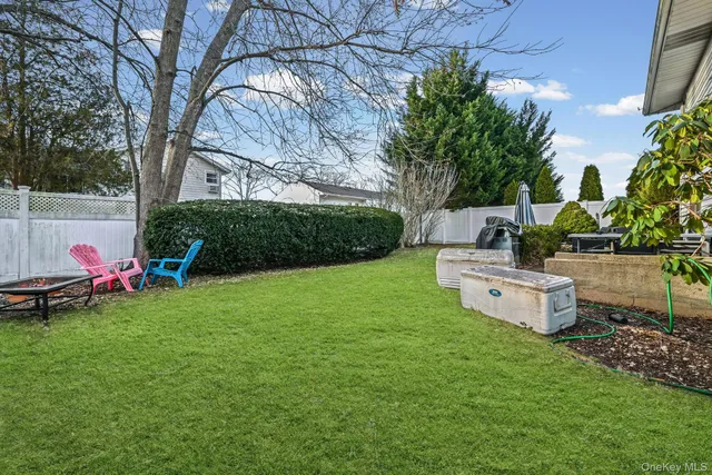 a view of a backyard with sitting area