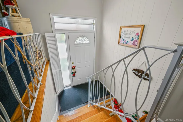 a view of front door with wooden floor