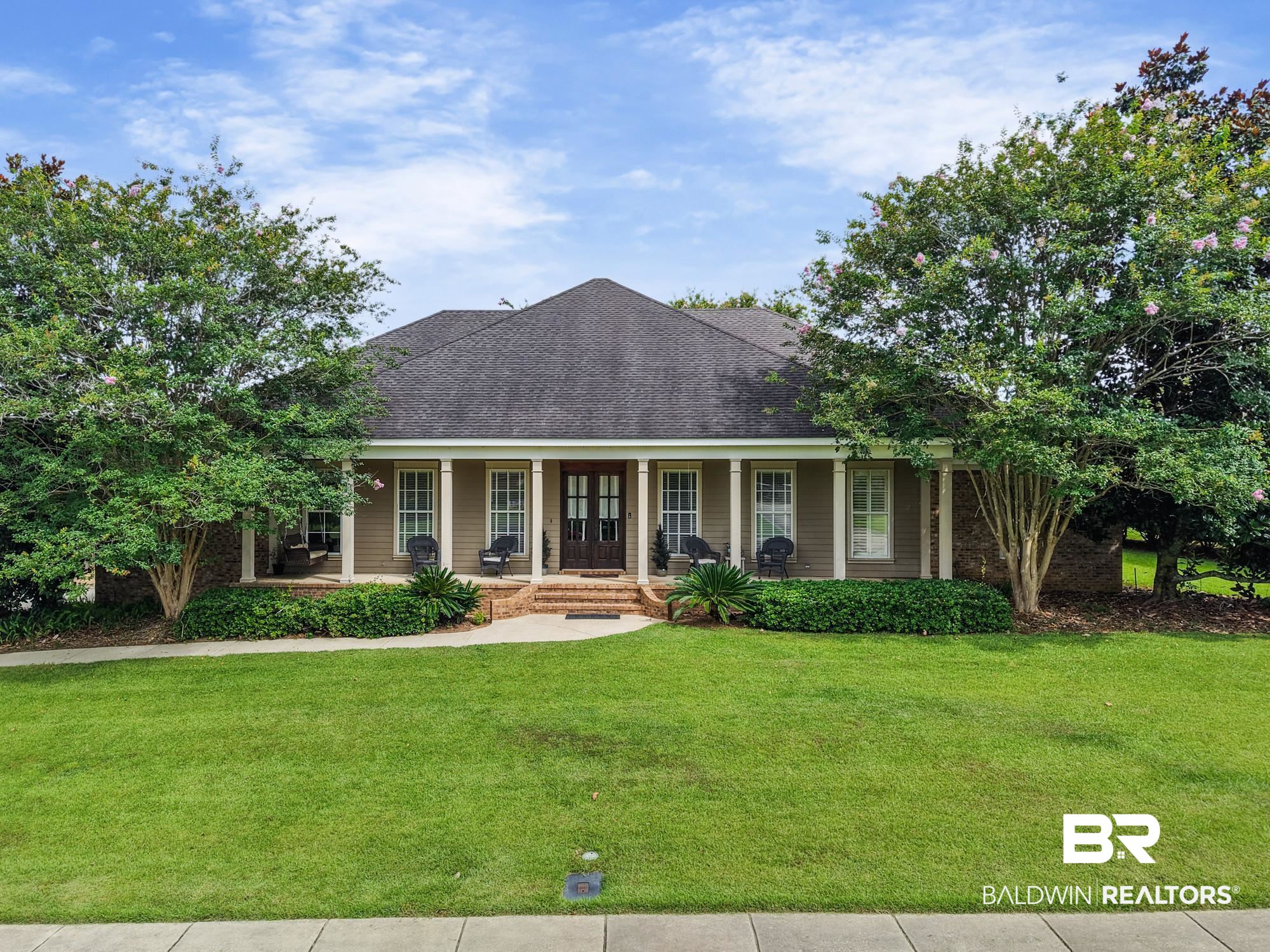 11261 Halcyon Loop Daphne, AL 36526 - Photo 1 of 41 Traditional-style residence featuring a prominent covered porch with classic columns