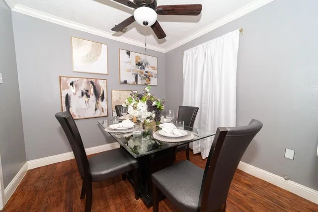 a view of a dining room with furniture window and wooden floor