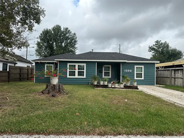 a front view of house with a garden and porch
