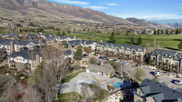 3598 North Huntsman Path, Unit 502 Eden, UT 84310 - Photo 32 of 43 Aerial perspective of suburban area featuring a mountain backdrop and a local golf course