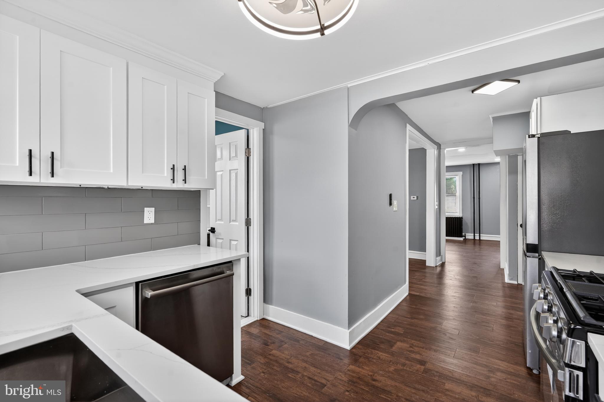 223 Noreg Place Brooklawn, NJ 08030 - Photo 21 of 36 a kitchen with stainless steel appliances granite countertop a refrigerator and a stove top oven