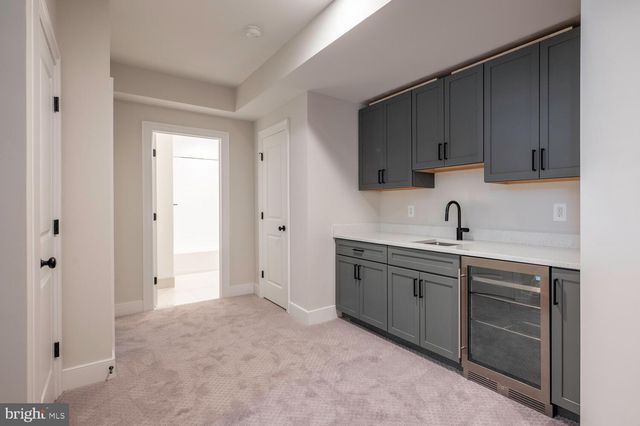 a spacious bathroom with a sink and a mirror