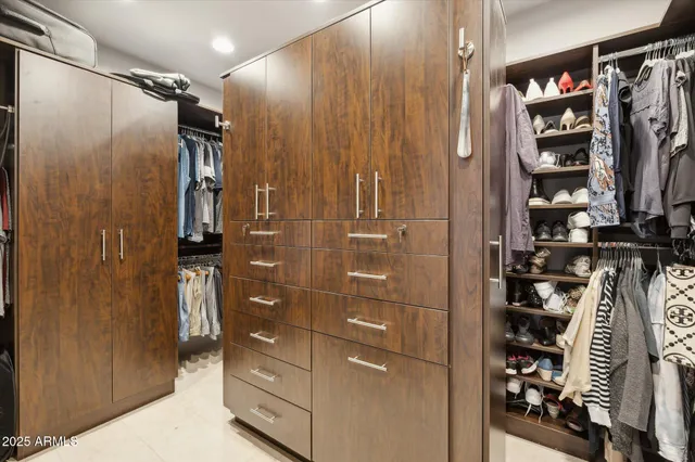 a bathroom with a shower and a glass door