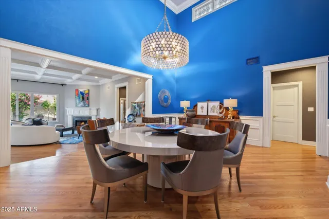 a view of a dining room with furniture and chandelier