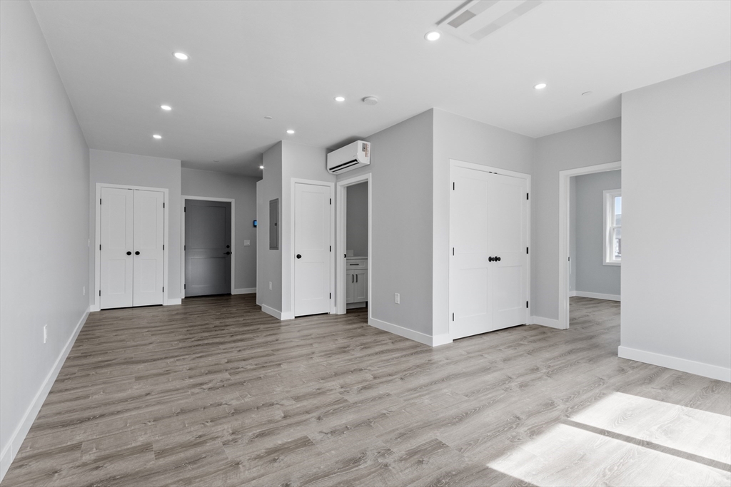 631 Franklin Street, Unit 209 Worcester, MA 01604 - Photo 12 of 42 a view of an empty room with wooden floor
