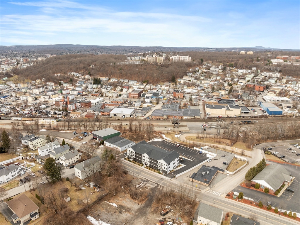 631 Franklin Street, Unit 209 Worcester, MA 01604 - Photo 37 of 42 an aerial view of residential building with parking