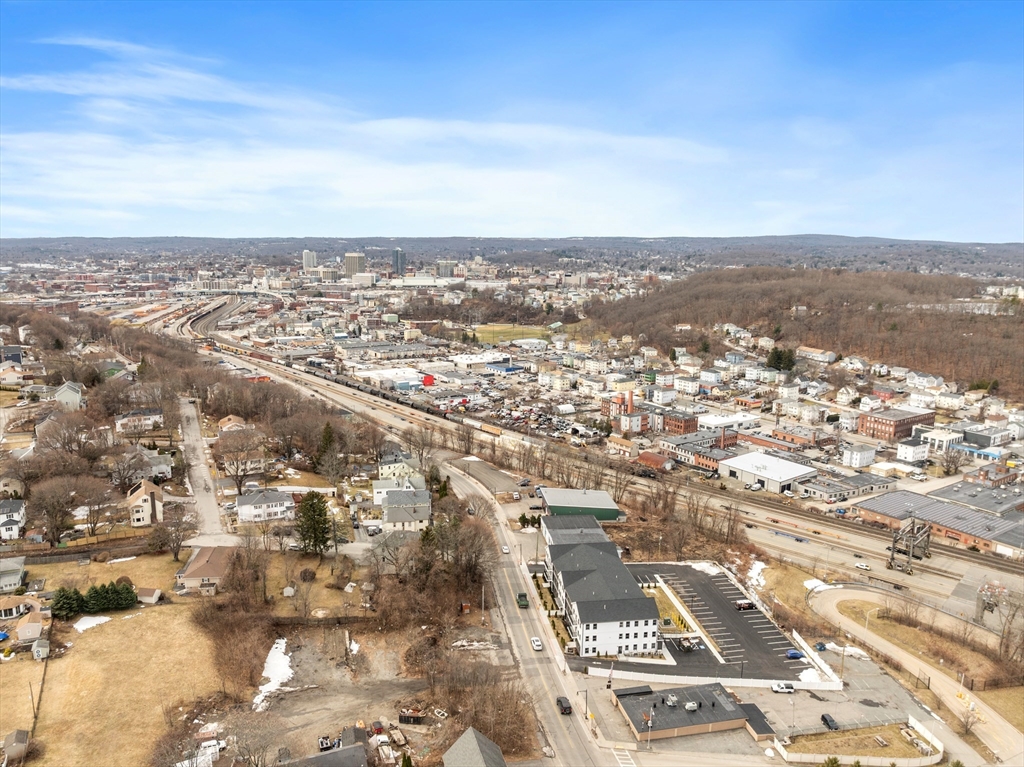 631 Franklin Street, Unit 209 Worcester, MA 01604 - Photo 38 of 42 an aerial view of residential building and parking space