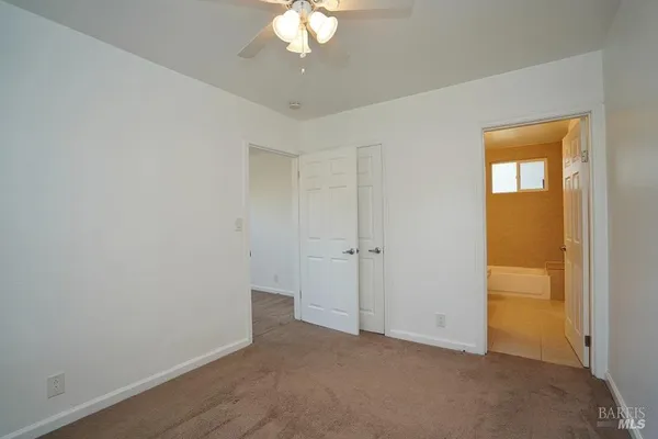 a kitchen with granite countertop a sink cabinets and stainless steel appliances