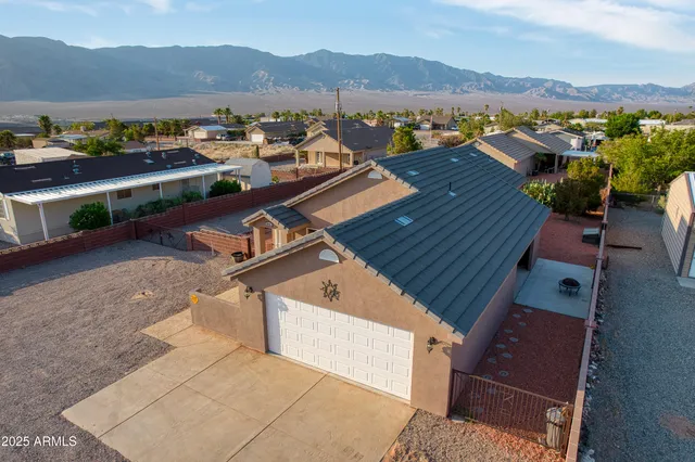an aerial view of a house with mountain view