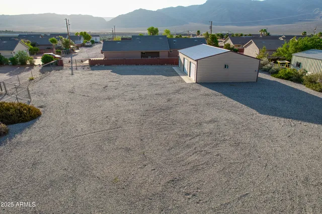 front view of a house with a mountain