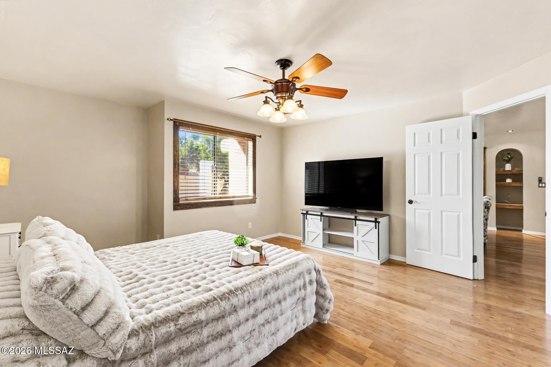 3781 East Edison Street Tucson, AZ 85716 - Photo 15 of 28 a bedroom with a bed and a flat screen tv