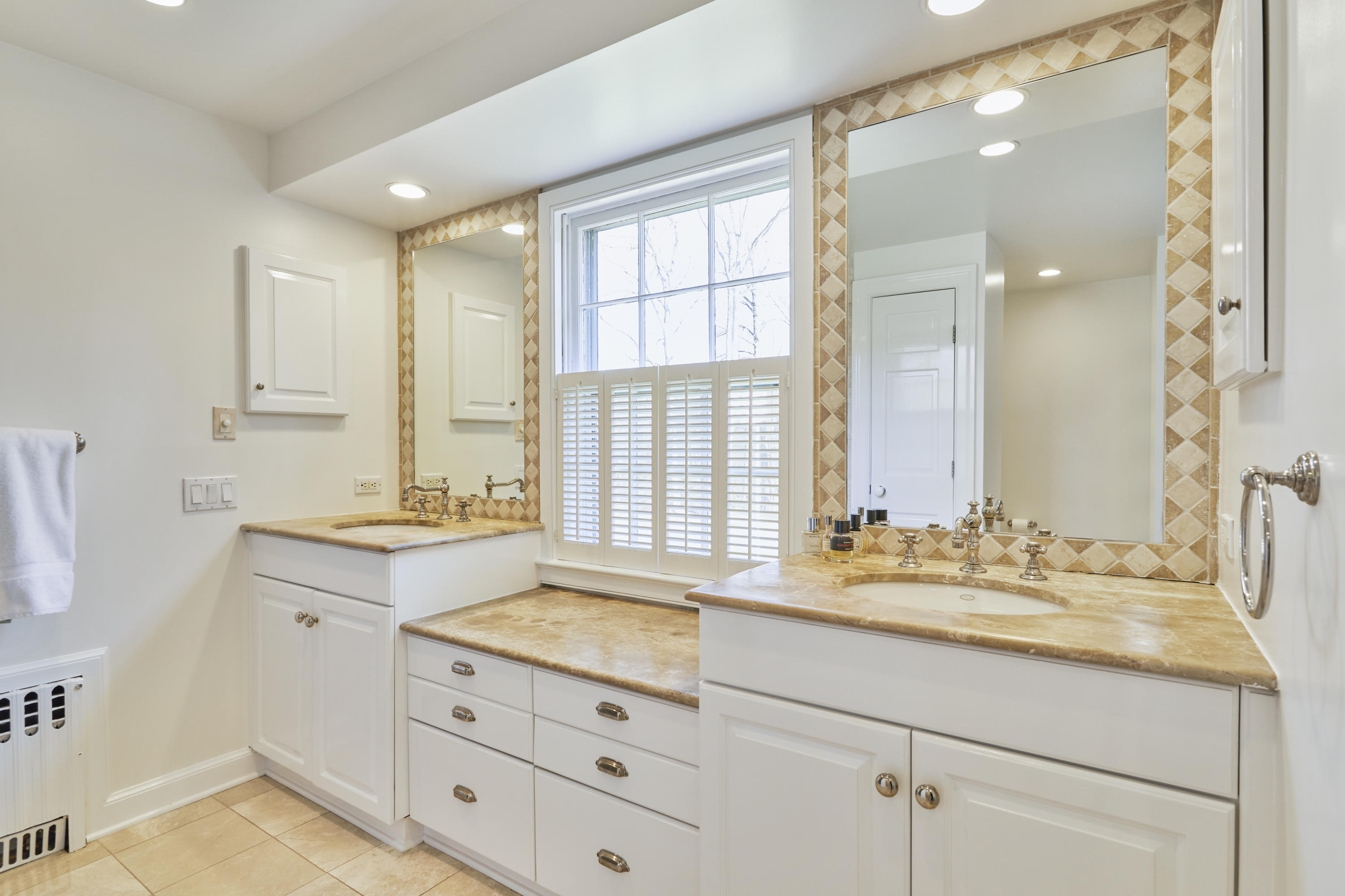 5 Driftway Lane Darien, CT 06820 - Photo 25 of 46 a bathroom with a sink double vanity and a mirror