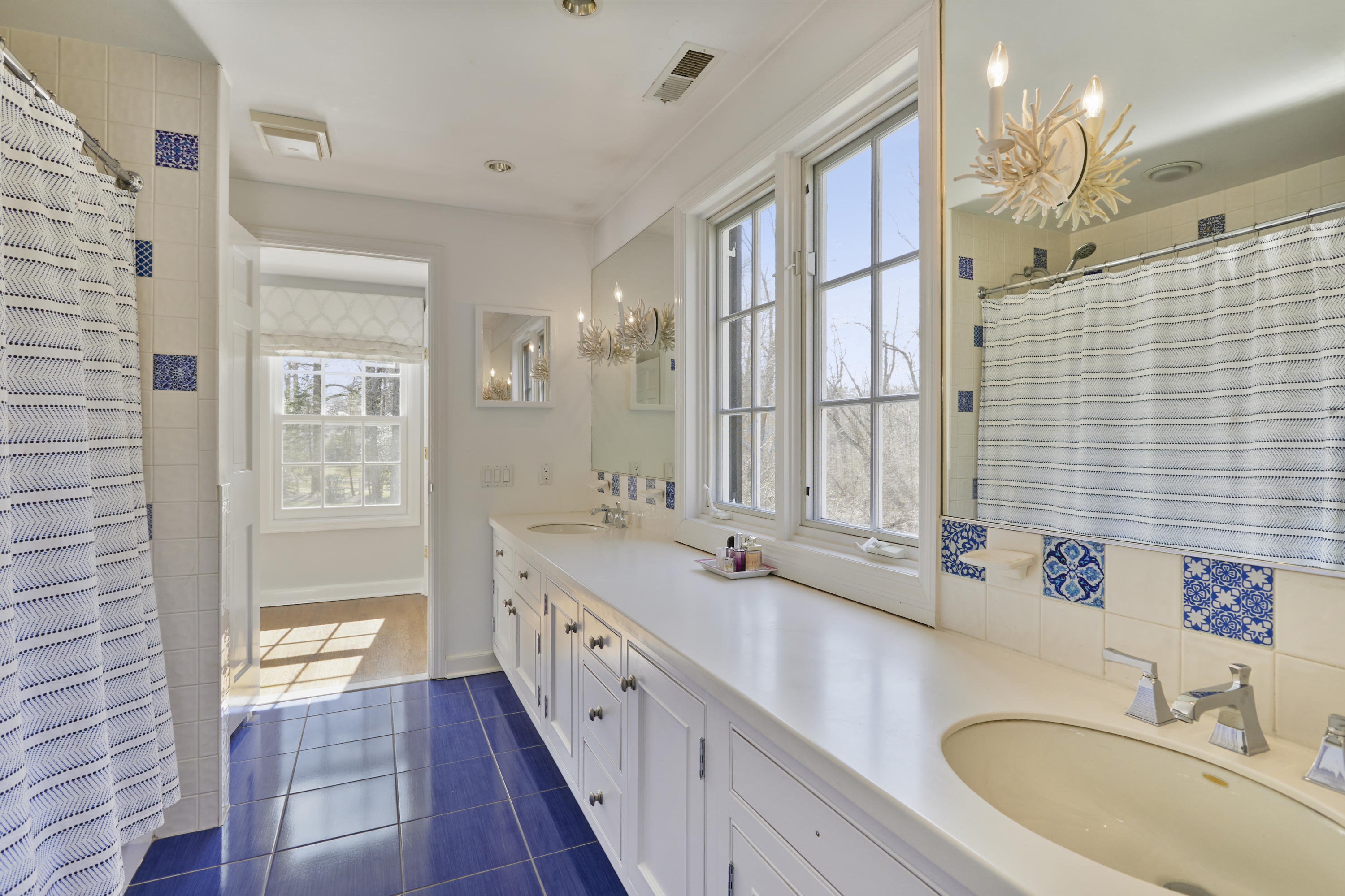 5 Driftway Lane Darien, CT 06820 - Photo 29 of 46 a bathroom with a double vanity sink mirror and double