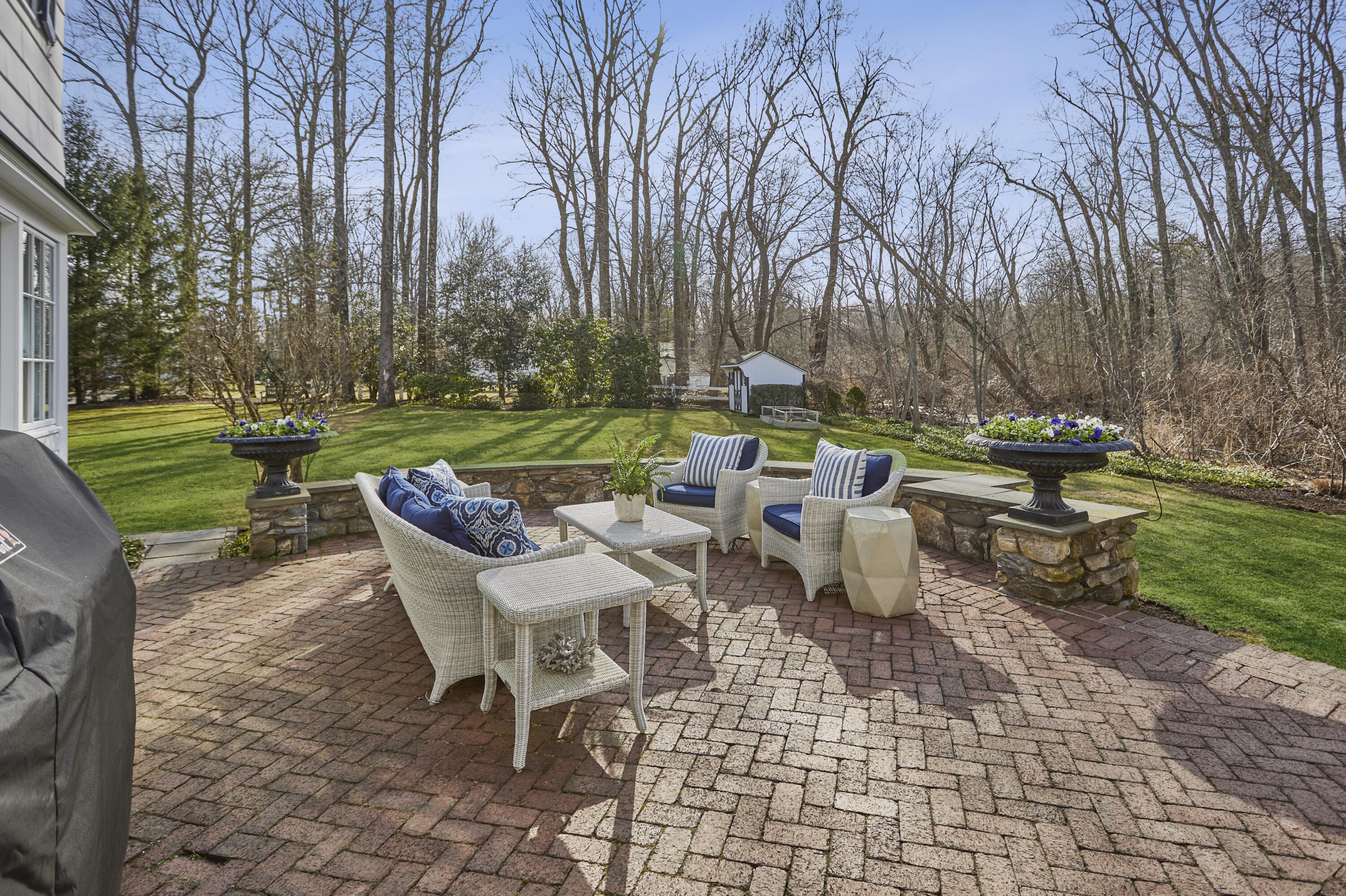 5 Driftway Lane Darien, CT 06820 - Photo 39 of 46 a view of a patio with table and chairs and potted plants