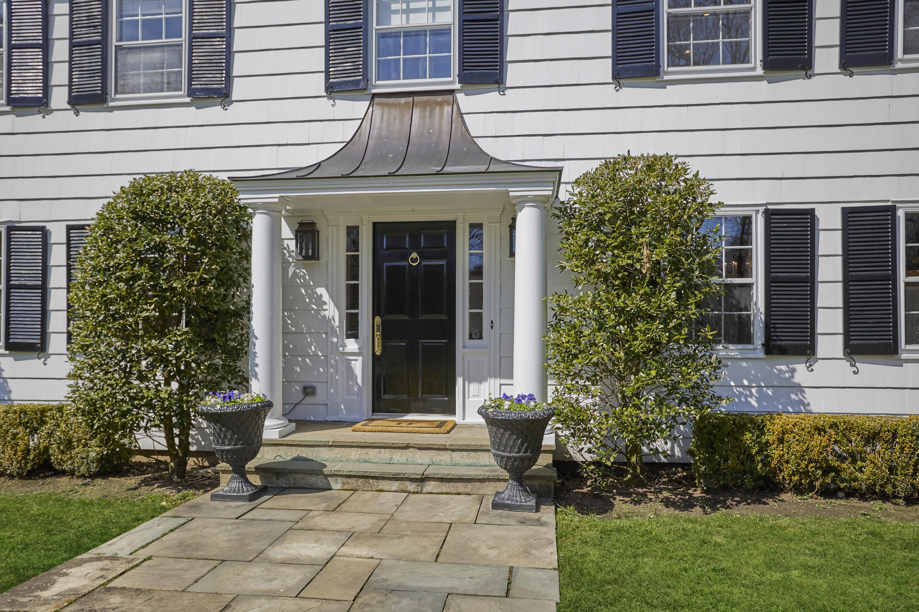 5 Driftway Lane Darien, CT 06820 - Photo 5 of 46 a view of a house with potted plants and a yard front of house