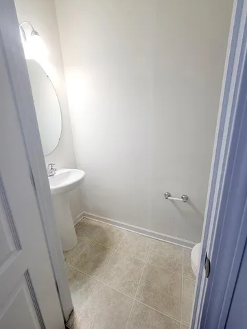 a bathroom with a sink and toilet