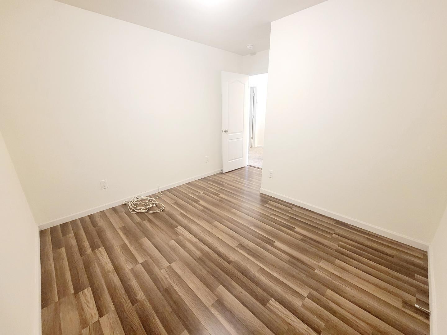 5423 Big Bass Drive Raleigh, NC 27610 - Photo 27 of 42 a view of a room with wooden floor
