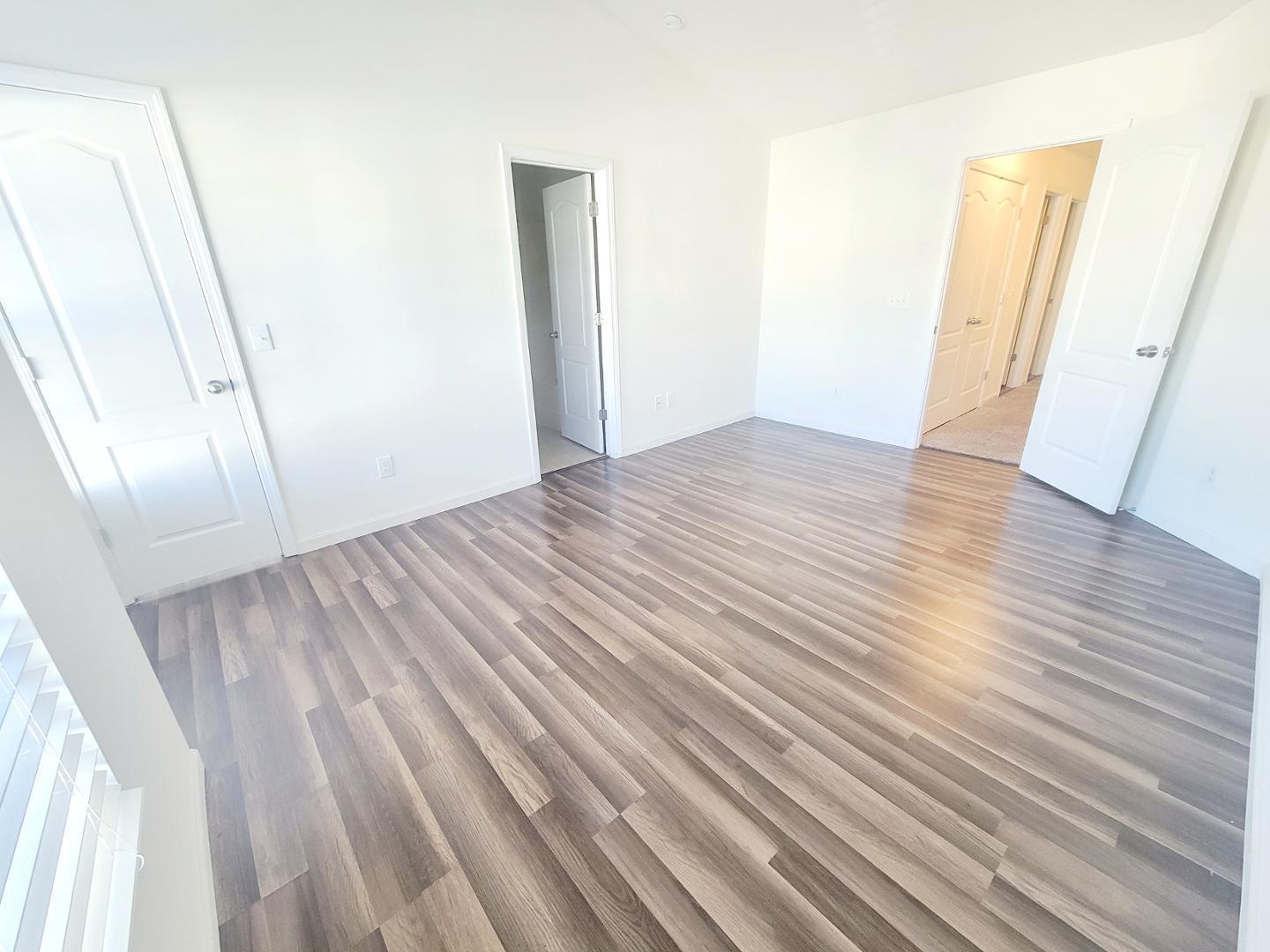 5423 Big Bass Drive Raleigh, NC 27610 - Photo 34 of 42 an empty room with wooden floor
