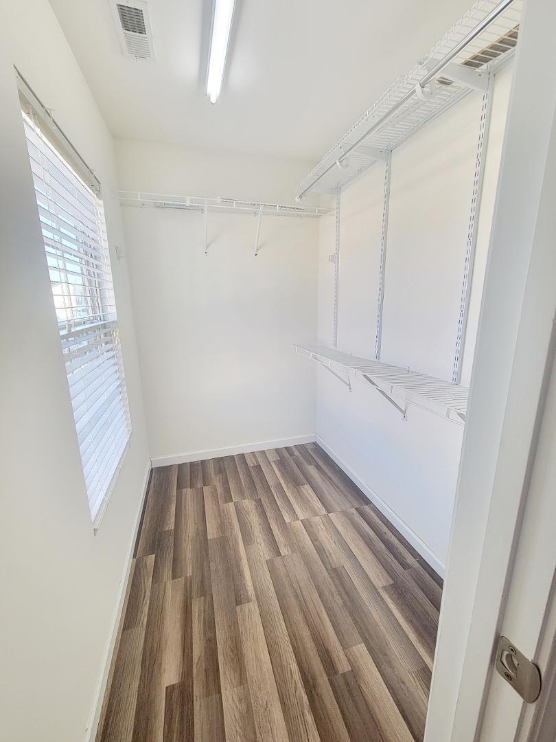 5423 Big Bass Drive Raleigh, NC 27610 - Photo 37 of 42 a view of an empty room with wooden floor and a window