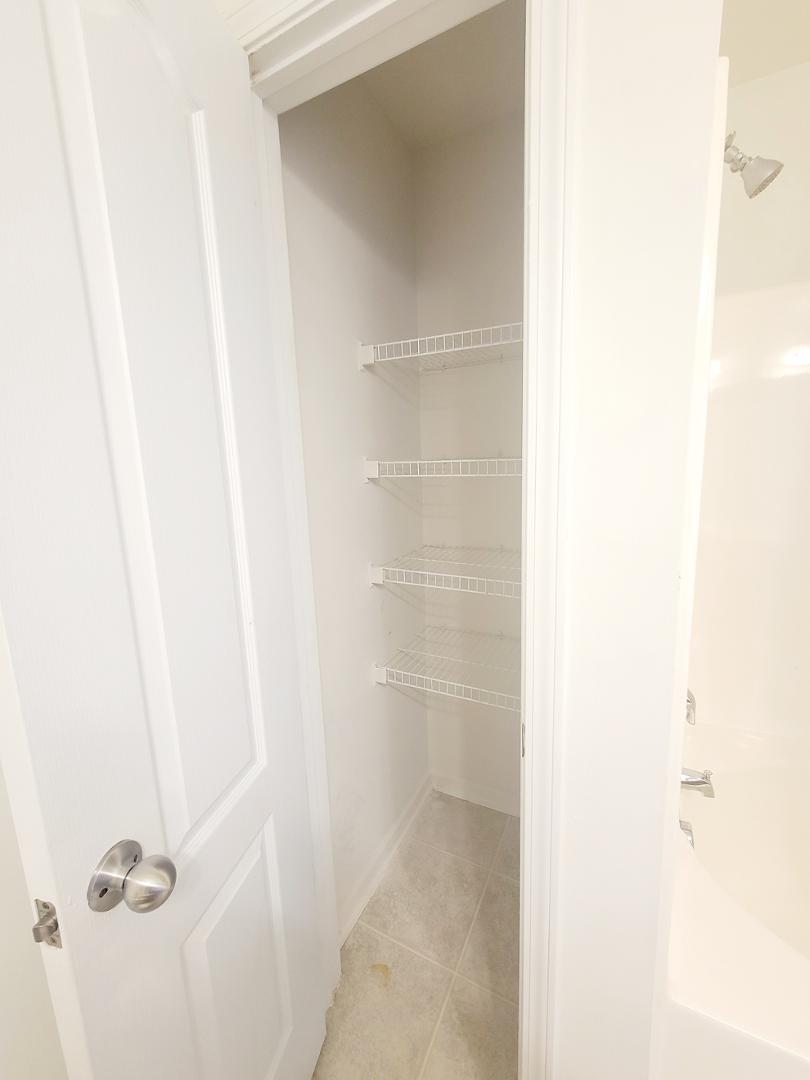 5423 Big Bass Drive Raleigh, NC 27610 - Photo 41 of 42 a bathroom with a glass shower door