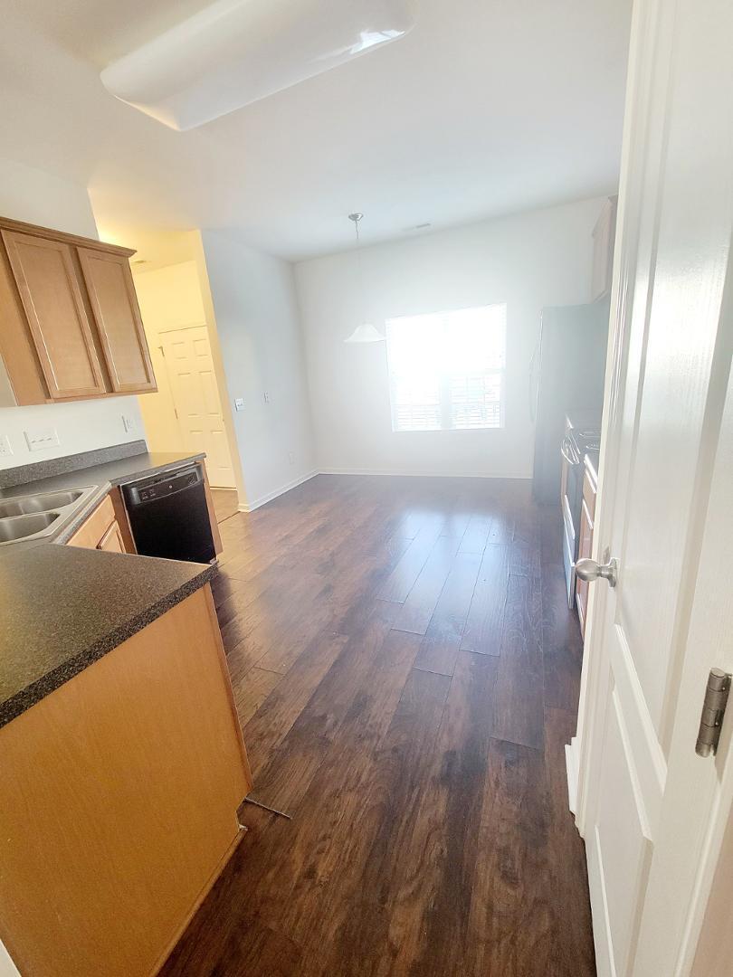 5423 Big Bass Drive Raleigh, NC 27610 - Photo 6 of 42 a view of an empty room and wooden floor