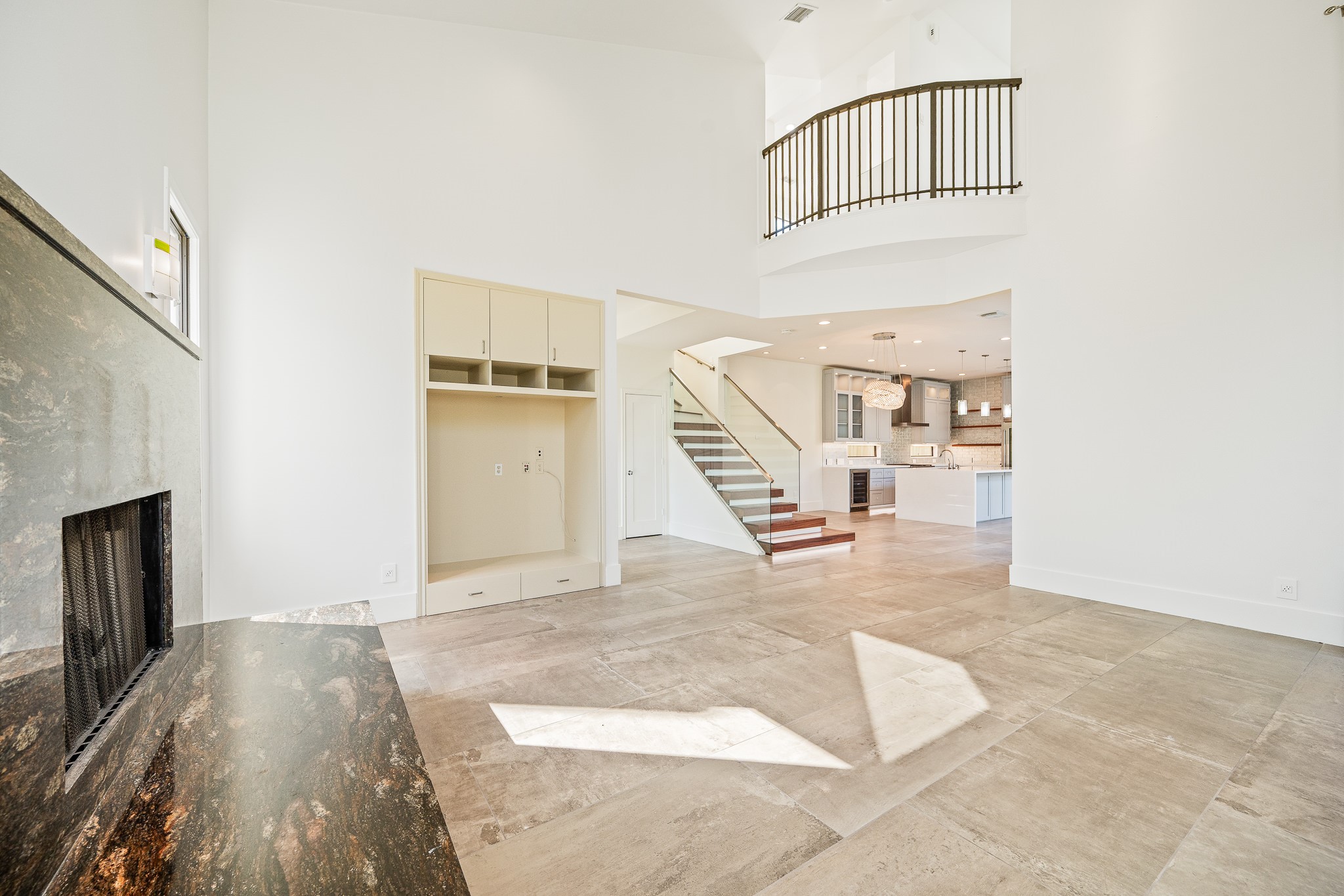 235 Malone Street Houston, TX 77007 - Photo 14 of 46 a view of a livingroom with wooden floor and a staircase